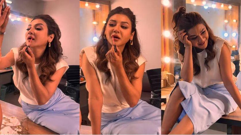 ১. মেকআপ রুমে আয়নার সামনে লিপস্টিক হাতে জয়া আহসান।
